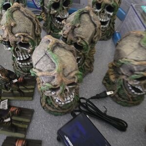 Decorative Skull Figurines with Green Accents